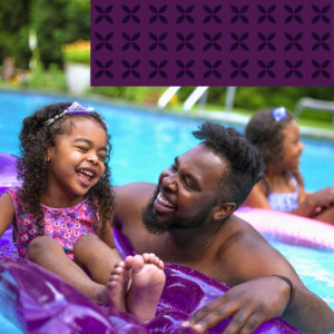 father and child in pool